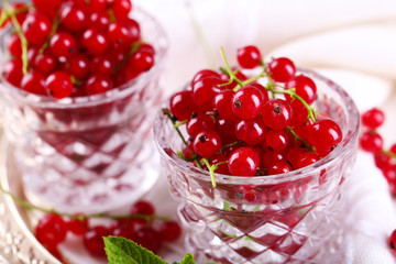 Fresh red currants in glasses close up