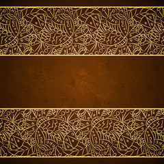 Card with gold floral ornament on brown grunge background