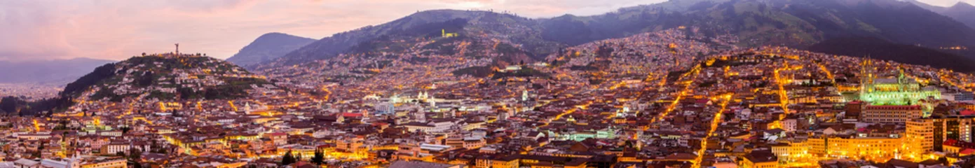 Foto op Plexiglas A captivating aerial view of Quito's historic center at night, showcasing a gothic church, charming old homes, and a mesmerizing cityscape. © Ammit