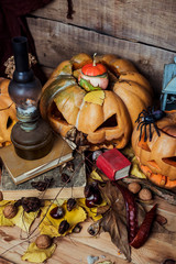 Halloween decoration with pumpkins on wooden background