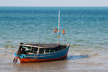 Old excursion boat at the coast in Mozambique.
