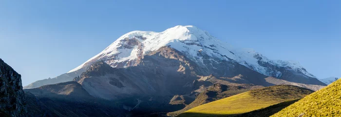 Schilderijen op glas A majestic view of Chimborazo, Ecuador's highest volcano and mountain, with its towering peak surrounded by mist at high altitude. © Ammit