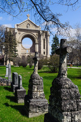 Fototapeta premium tombstones and St.Boniface cathedral, Winnipeg, Manitoba