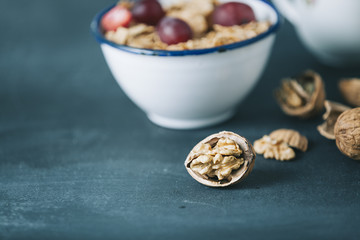 breakfast with cornflakes and milk on dark wooden table