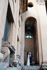 the bride and groom  with a wedding bouquet on the background of