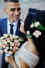 the groom smiling bride