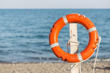 Life preserver on sandy beach