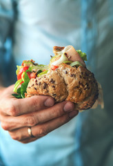 Close up image man hand with big hamburger © Soloviova Liudmyla