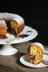Cocoa gugelhupf on old wooden table