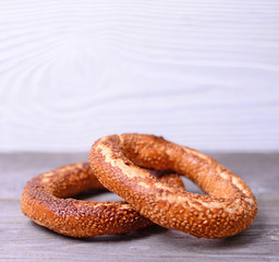 Fresh cook bagel on wooden background
