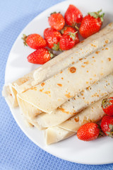 Pancakes with chocolate and strawberries