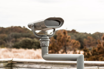 Front of sightseeing binoculars at First Landing State Park beach in Virginia Beach, Virginia