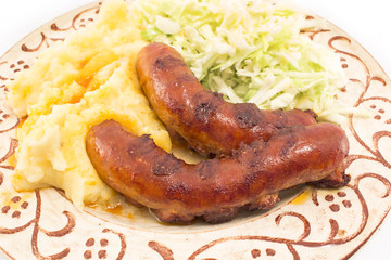 Sausages with mashed potatoes and cabbage salad