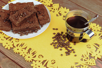 On a wooden table on yellow napkin