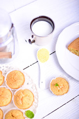 White teaspoon with corn flour on white table