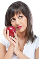 Young woman eating red apple