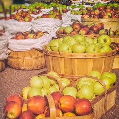 Apples at a Farmers Market. Baskets of apples, freshly picked in early autumn.