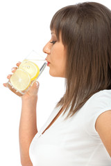 Woman drinking water with lemon