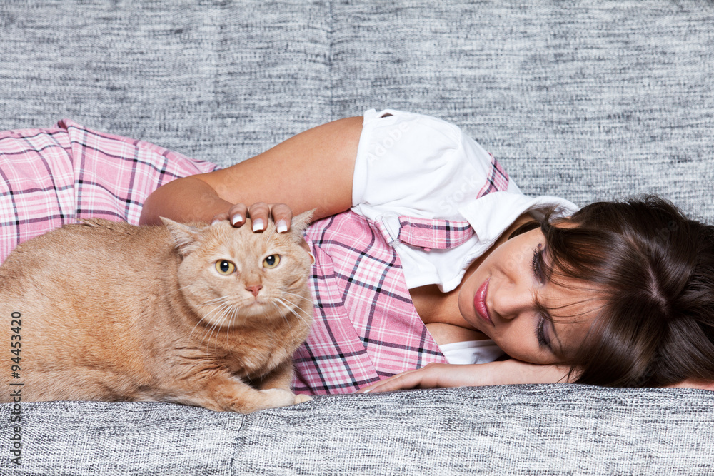 Wall mural young woman with cat