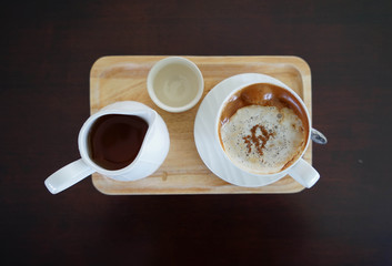 cup of hot coffee and tae pot