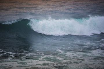 Blue wave at sunset Bali Beach ,Indonesia.