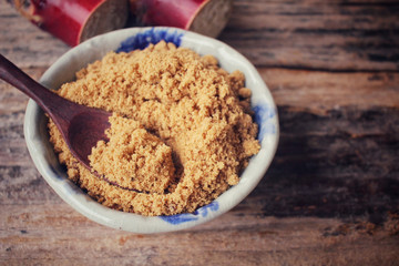 Brown sugar with sugar cane