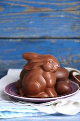 Easter chocolate bunny and eggs on wooden background