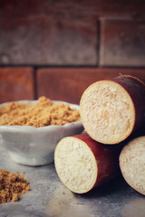 Brown sugar with sugar cane