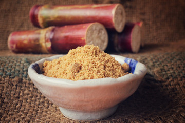 Brown sugar with sugar cane