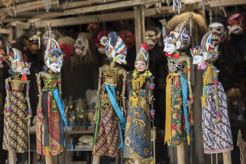 Souvenir from Bali island. Traditional wood painting puppet. Indonesia.