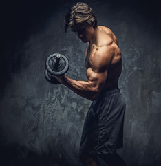 Shirtless bodybuilder doing exercises.