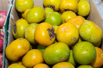 Persimmons fruit at the farmers market
