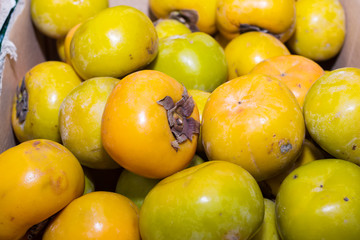 Persimmons fruit at the farmers market
