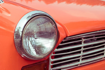 Fototapeta na wymiar close-up headlight of colourful classic car