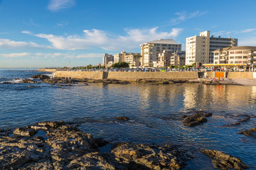 Local people and tourists in a beautiful day walking around the sea point area in Cape town, South Africa