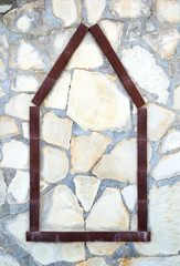 House icon on stone background, home construction concept