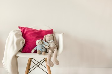 Infant accessories on white chair