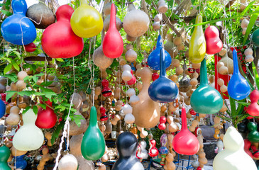 Small colorful hanging pumpkins - merry background