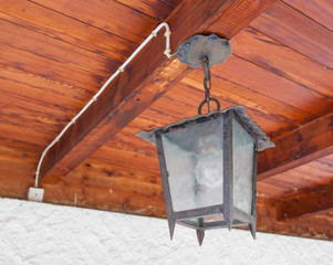 Vintage looking metal lantern with modern lamp