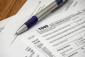 Tax form with pen