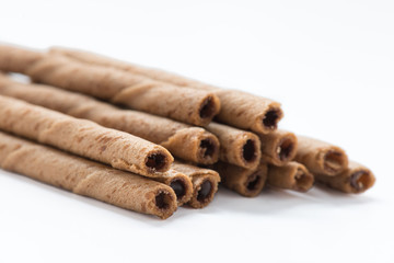 Chocolate wafer sticks isolated on white background.