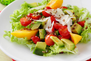 salad with avocado on white plate