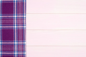 Purple towel over wooden table