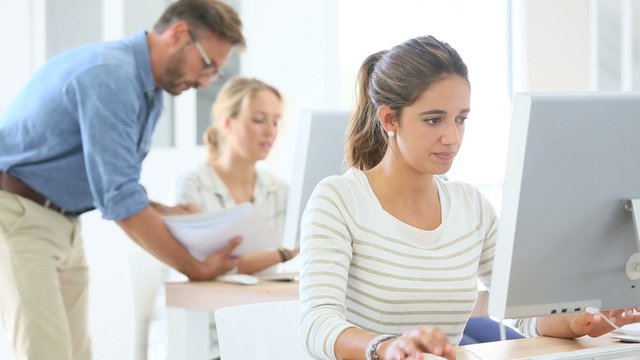 Portrait of smiling student in computing class