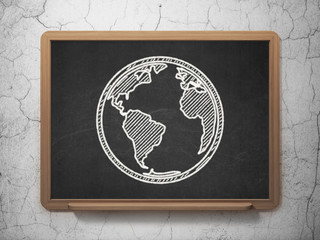 Learning concept: Globe on chalkboard background
