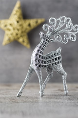 Silver deer on gray background. Christmas background.