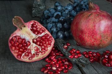 still life of pomegranates and grapes