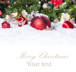 Christmas background with a red ornament on snow, Holiday decoration 