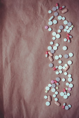 Pills on the paper background.