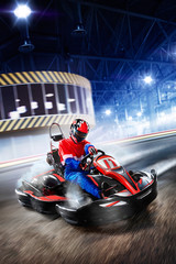 Two cart racers are racing on the grand track